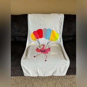 Beach Towel with Flamingo and Parachute.  100% cotton.  56.5” x 28”.